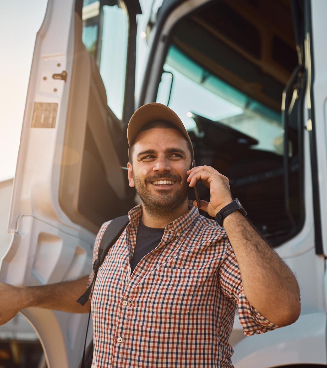 Truck driver happy about finding a parking space – Stress-free parking search with Happy Trucker